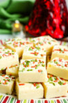 a close up photo of white chocolate fudge squares on a tray