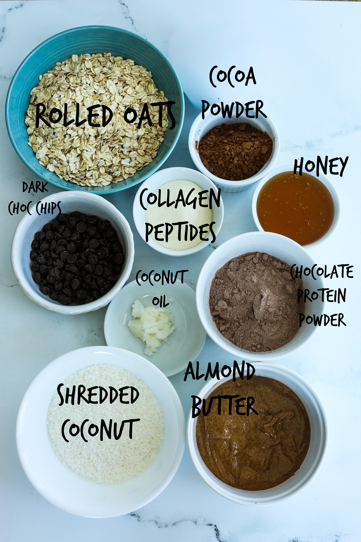 ingredients for chocolate protein balls in bowls