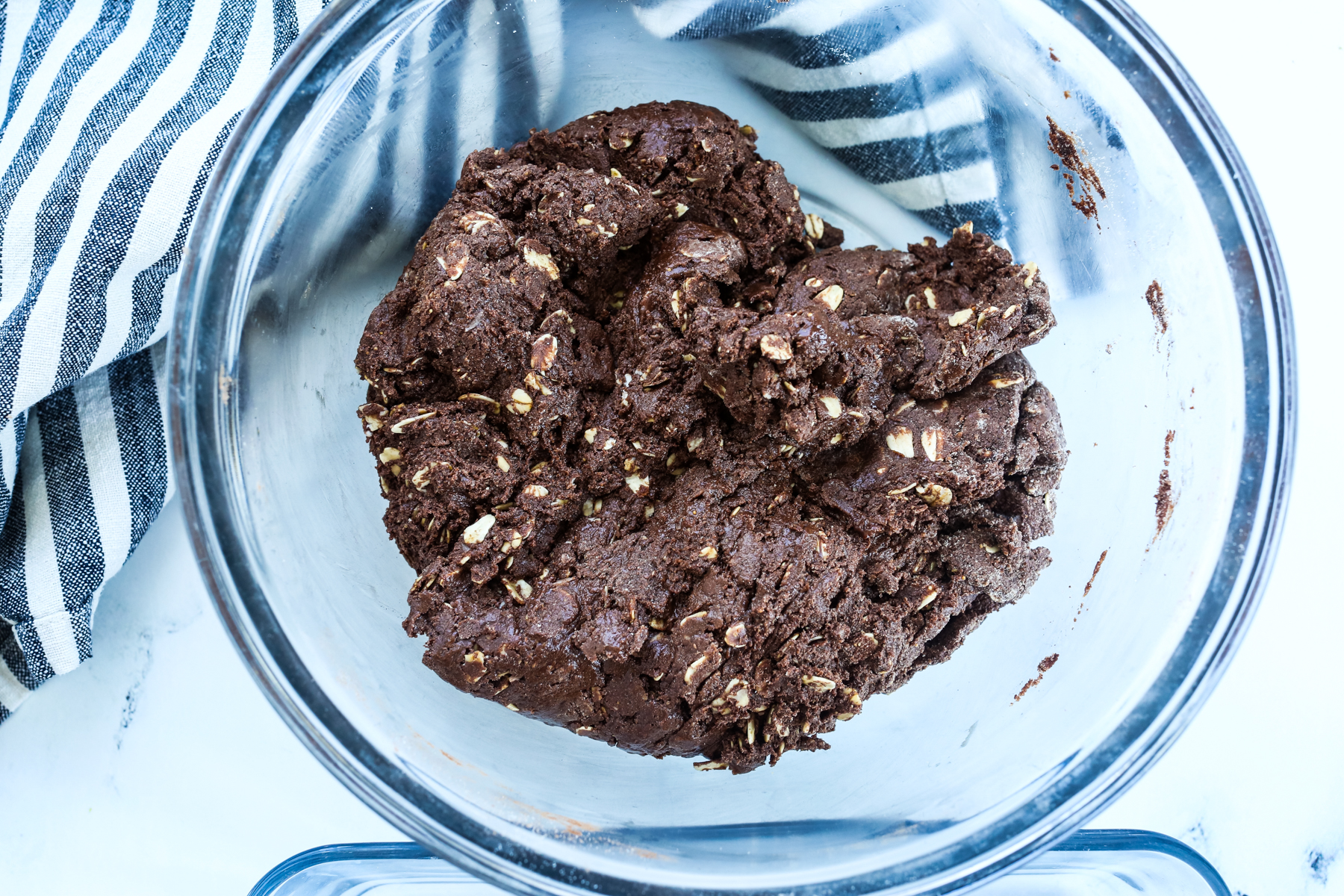 a dark chocolate dough in a bowl 