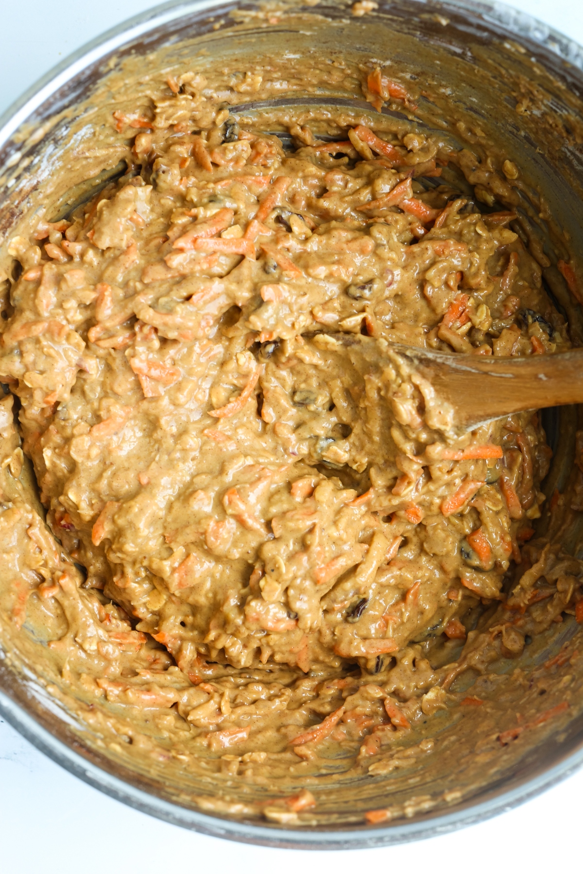 mixing batter with a wooden spoon