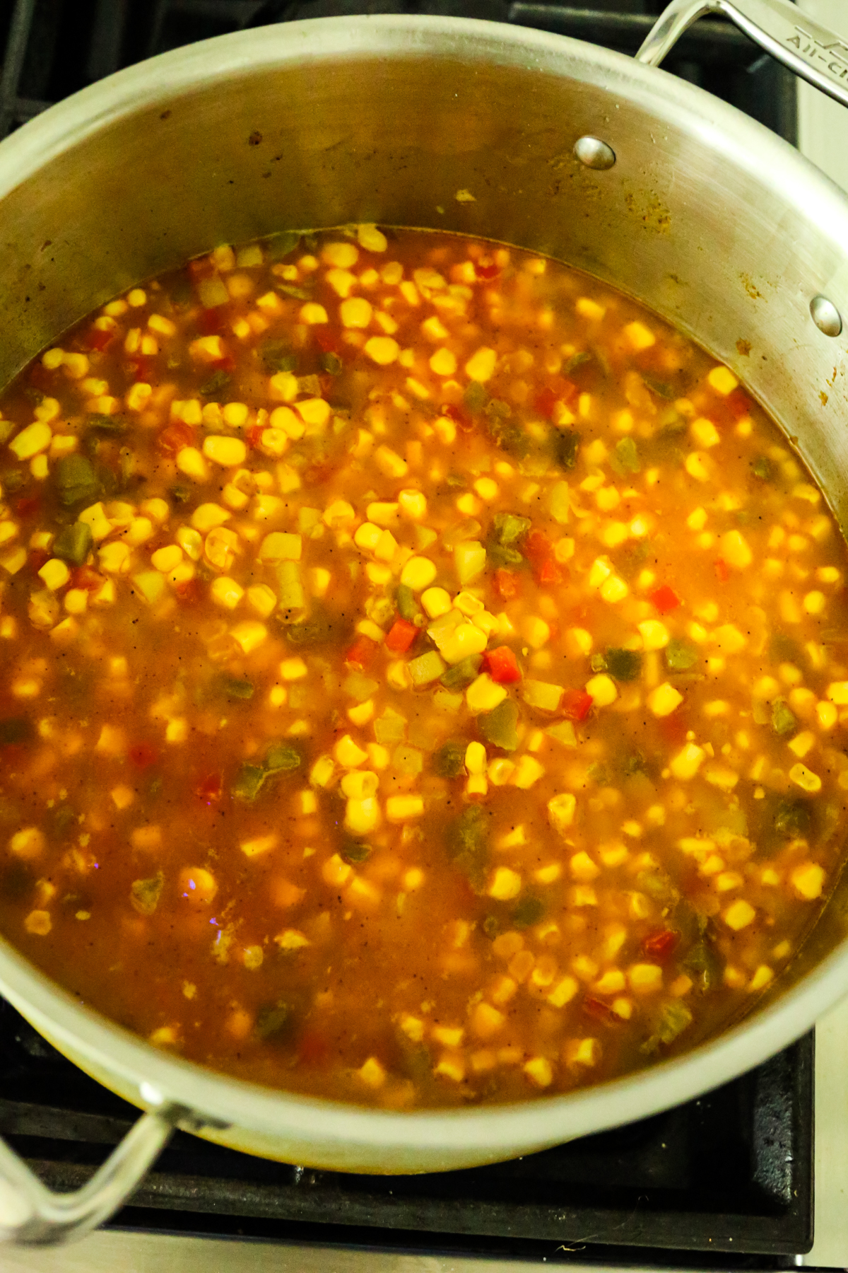 simmering corn and vegetables for chowder