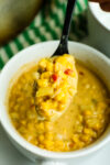close up shot of Mexican street corn chowder on a spoon