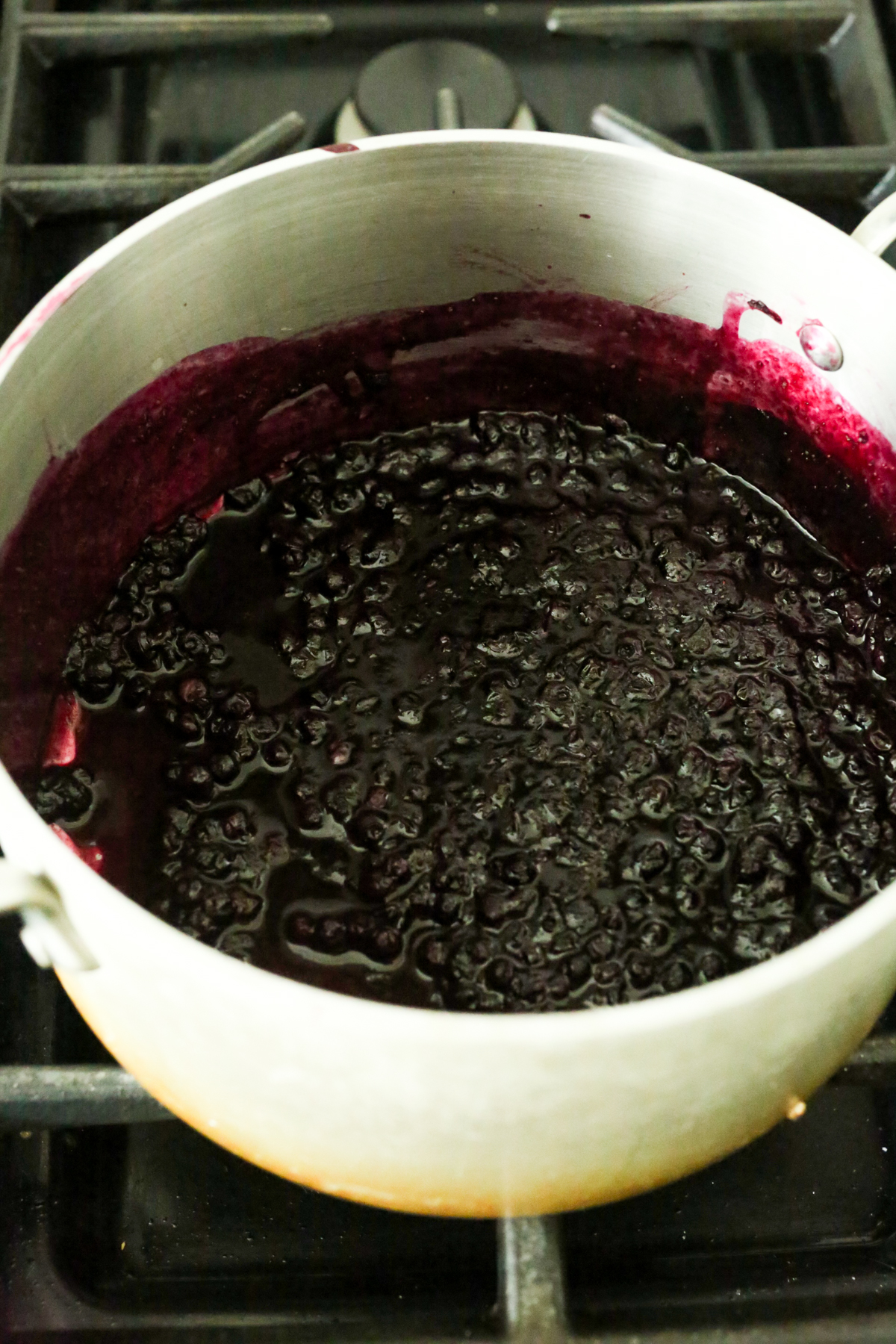blueberries simmering in a sauce pan