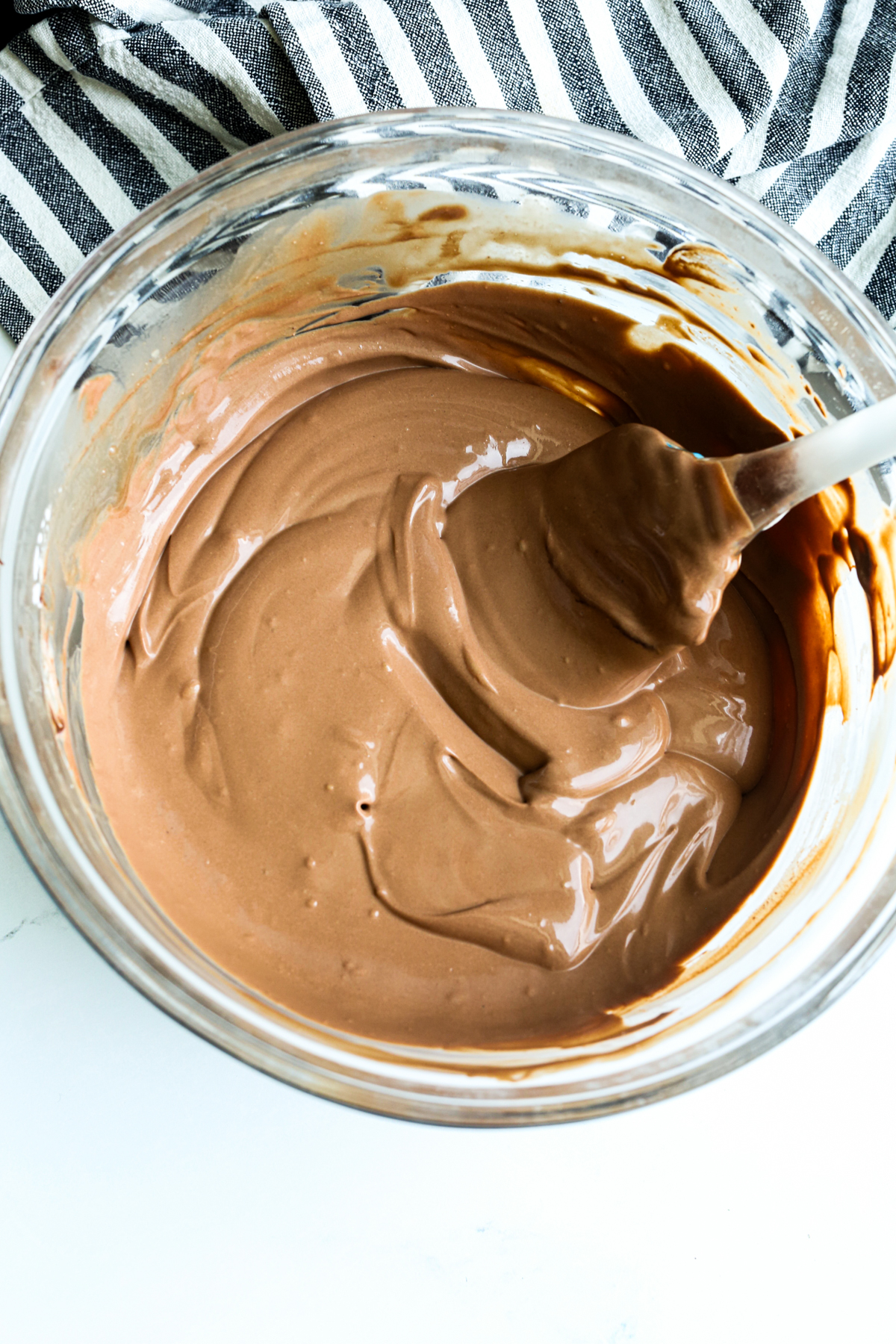 making cottage cheese chocolate mousse in a glass bowl