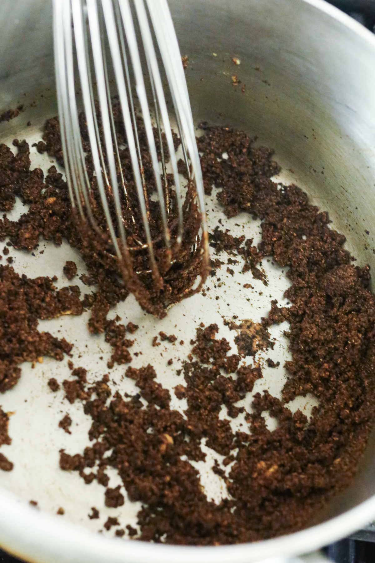 adding spices to the pan