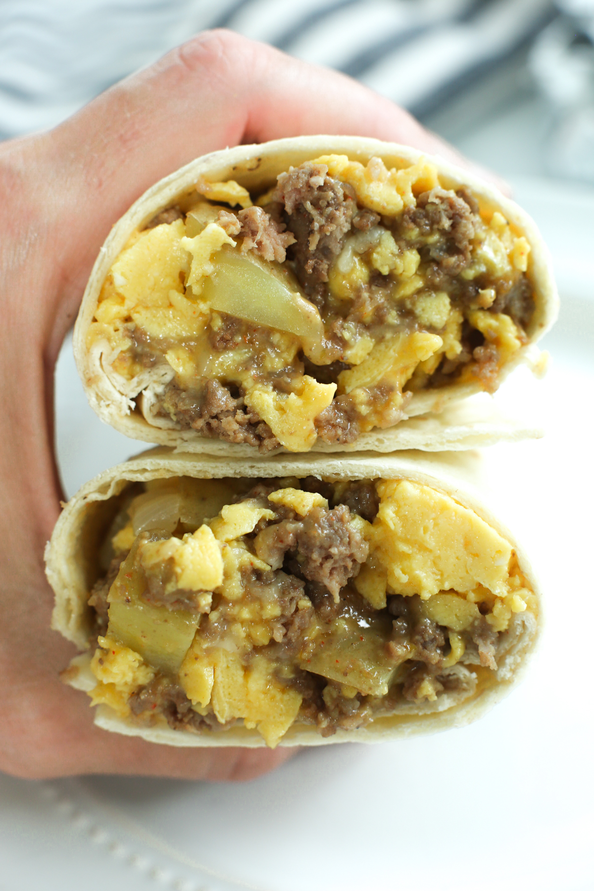 two halves of a make ahead breakfast burritos